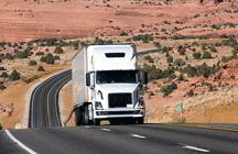 Truck on picturesque highway (iStockphoto)