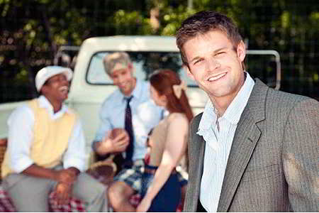 Young adults at tailgate party (iStockphoto)