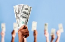 Hands holding up money