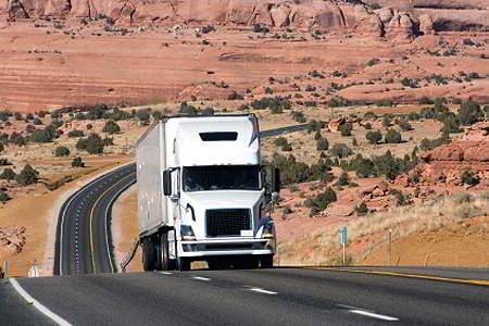 Truck on picturesque highway (iStockphoto)