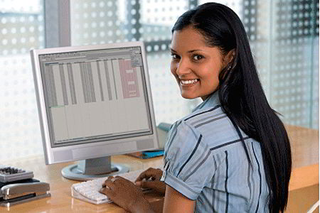 Young woman at computer (iStockphoto)